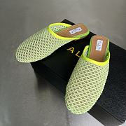 ALAIA | Flat-soled half-slippers in green - 4