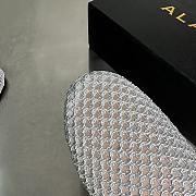 ALAIA | Flat-soled half-slippers in gray - 5