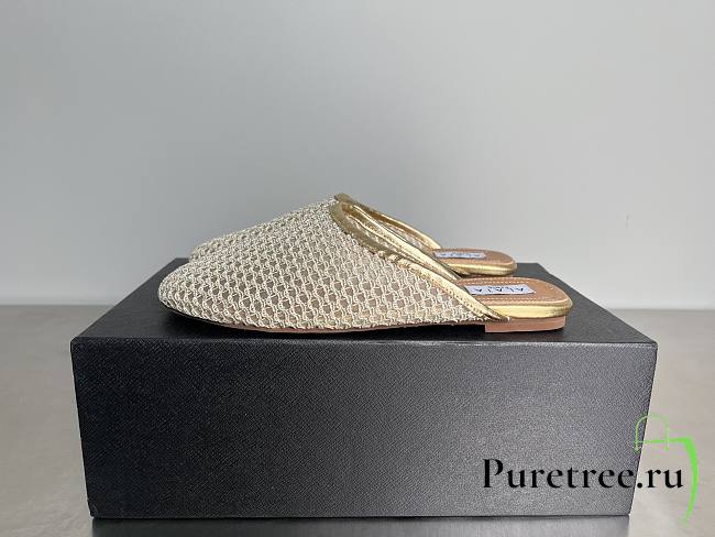 ALAIA | Flat-soled half-slippers in gold - 1