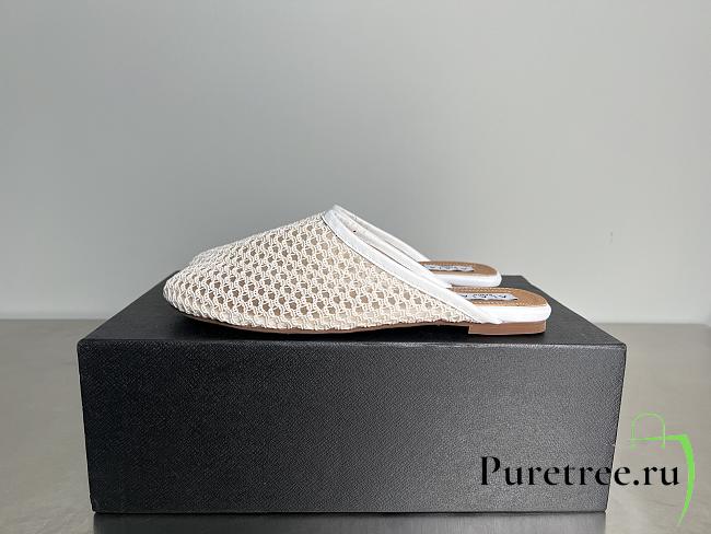 ALAIA | Flat-soled half-slippers in white - 1