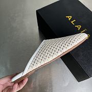 ALAIA | Flat-soled half-slippers in white - 6