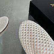ALAIA | Flat-soled half-slippers in white - 4