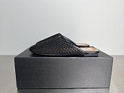 ALAIA | Flat-soled half-slippers in black - 1