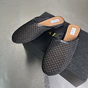 ALAIA | Flat-soled half-slippers in black - 4