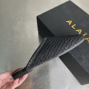 ALAIA | Flat-soled half-slippers in black - 3