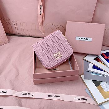 MIUMIU | Quilted effect leather wallet in pink