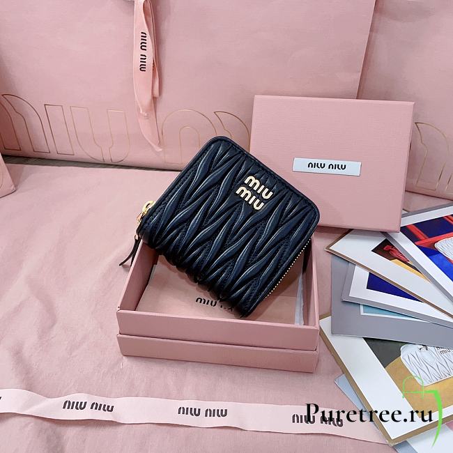 MIUMIU | Quilted effect leather wallet in black - 1