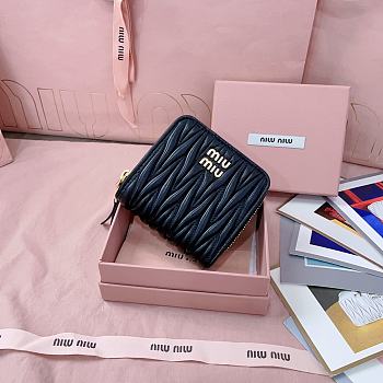 MIUMIU | Quilted effect leather wallet in black