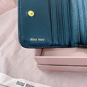 MIUMIU | Quilted effect leather wallet in black - 2