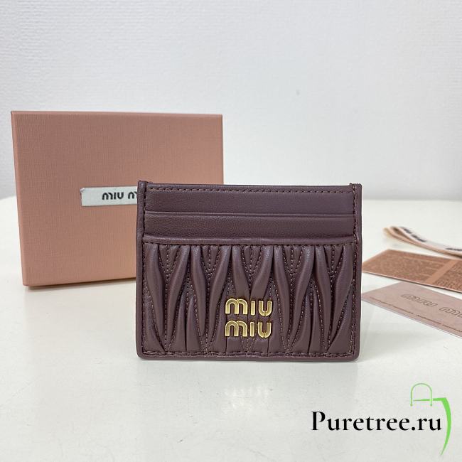 MIUMIU | Matelassé nappa leather card holder in burgundy - 1